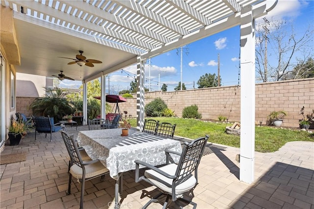 view of patio / terrace featuring a pergola, a ceiling fan, outdoor dining space, and a fenced backyard