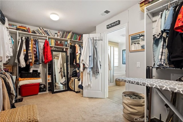 spacious closet with visible vents and carpet