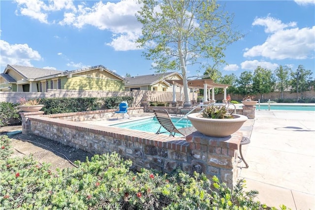 pool featuring fence and a patio