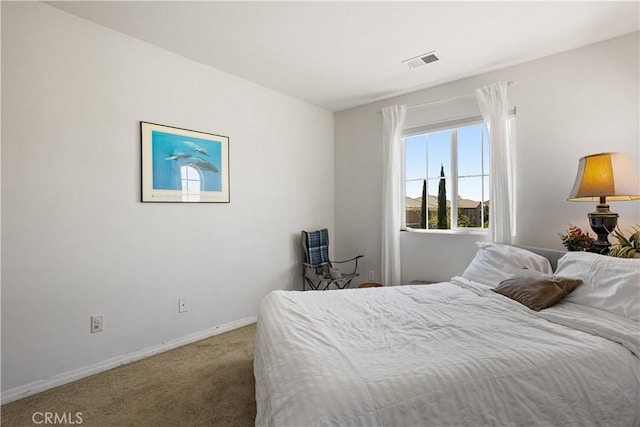 bedroom with visible vents, carpet flooring, and baseboards