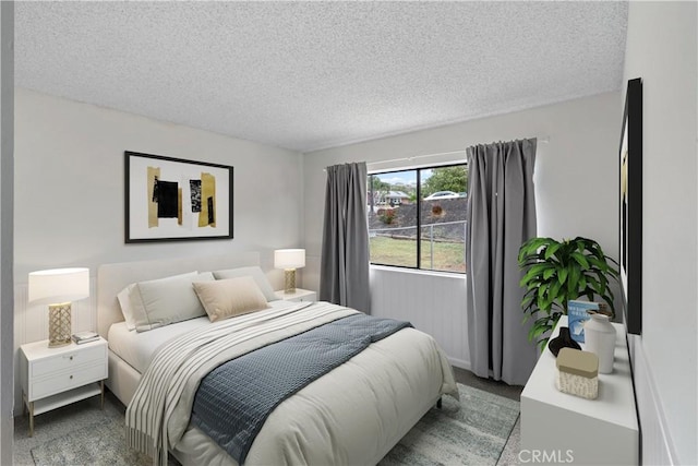 bedroom featuring a textured ceiling