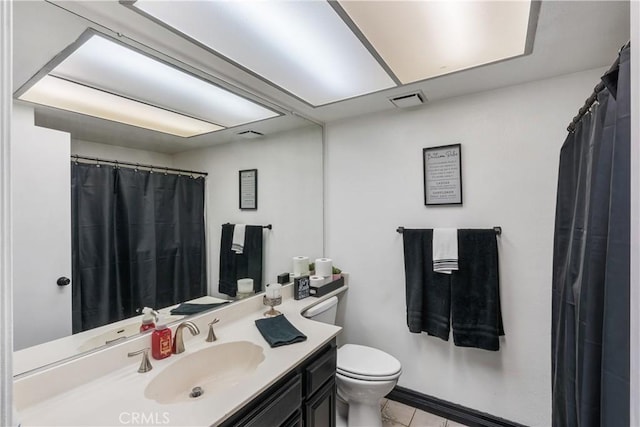 full bathroom featuring vanity, toilet, tile patterned flooring, and visible vents