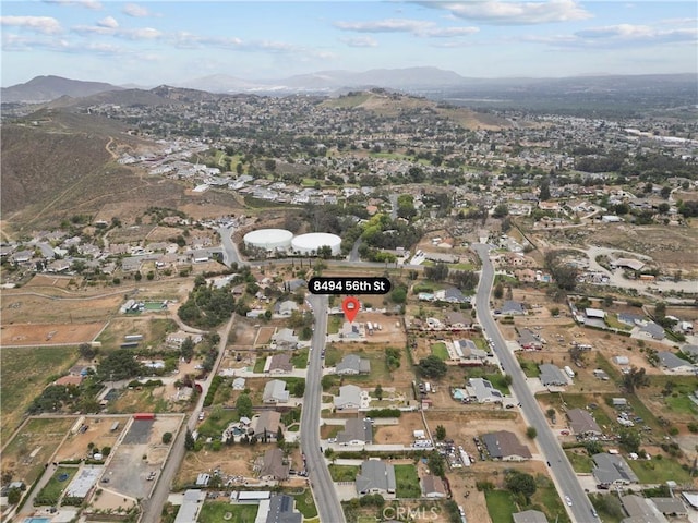birds eye view of property with a mountain view and a residential view