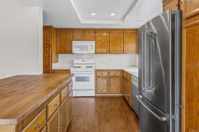 688 Via Encantada, Chula Vista, CA 91913 - kitchen with white appliances, wood counters, brown cabinets, dark wood finished floors, and recessed lighting