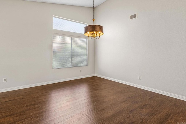 688 Via Encantada, Chula Vista, CA 91913 - spare room with a chandelier, dark wood-style floors, baseboards, and vaulted ceiling