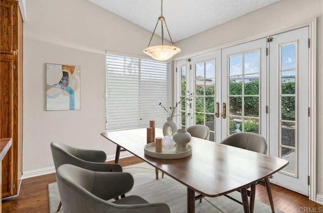 688 Via Encantada, Chula Vista, CA 91913 - dining area with french doors, baseboards, lofted ceiling, dark wood-style flooring, and a textured ceiling