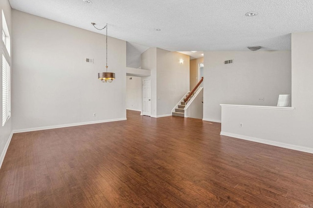 688 Via Encantada, Chula Vista, CA 91913 - unfurnished living room featuring wood finished floors, a chandelier, a textured ceiling, baseboards, and stairway