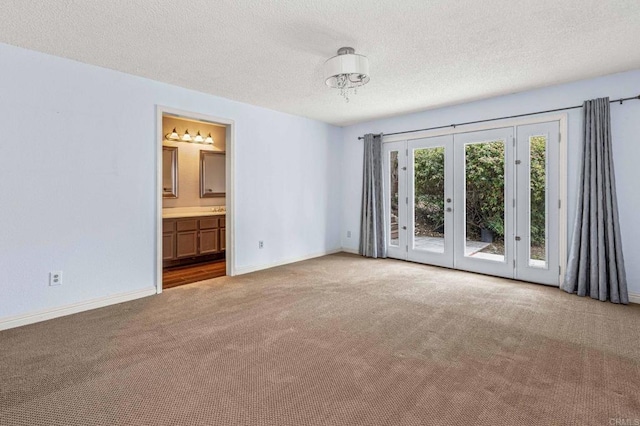 688 Via Encantada, Chula Vista, CA 91913 - empty room with carpet, baseboards, a textured ceiling, and french doors