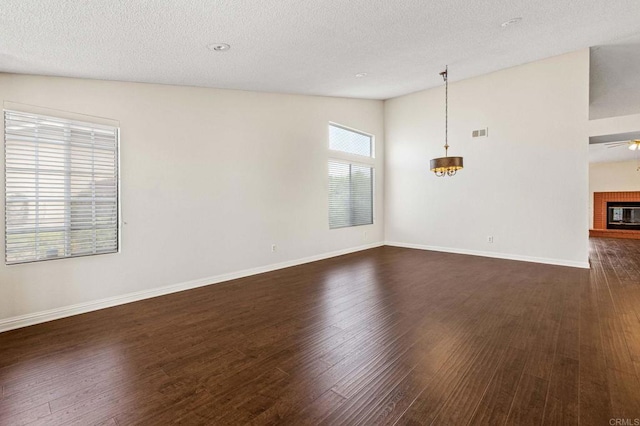 688 Via Encantada, Chula Vista, CA 91913 - spare room featuring dark wood-style floors, baseboards, a textured ceiling, vaulted ceiling, and ceiling fan