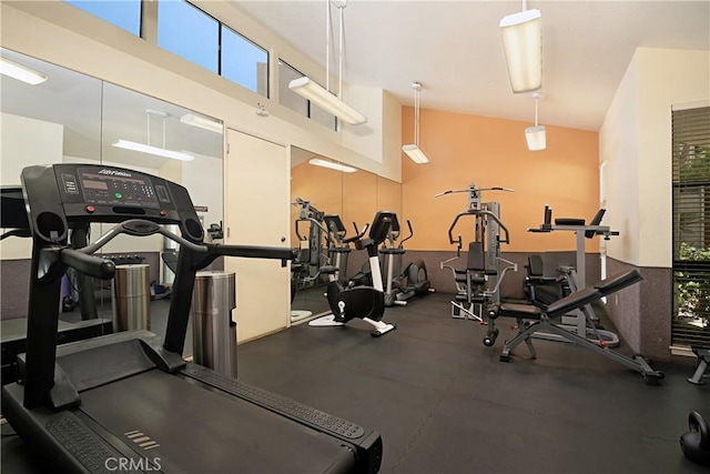 gym with high vaulted ceiling