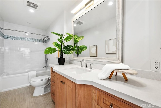 bathroom featuring tub / shower combination, visible vents, toilet, and vanity