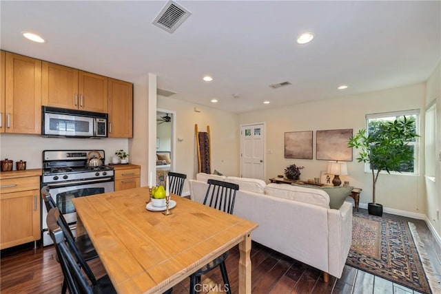 dining area featuring dark wood-type flooring, visible vents, and recessed lighting