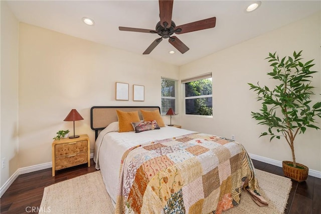 bedroom featuring baseboards, wood finished floors, and recessed lighting