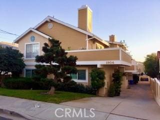 1904 Carnegie Ln Unit 2, Redondo Beach, CA 90278 - view of front of home featuring a chimney