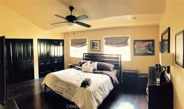 1904 Carnegie Ln Unit 2, Redondo Beach, CA 90278 - bedroom with a ceiling fan, two closets, dark wood-style flooring, and lofted ceiling