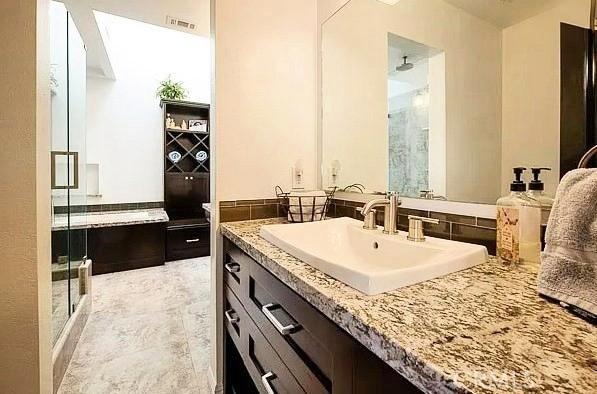 1904 Carnegie Ln Unit 2, Redondo Beach, CA 90278 - bathroom featuring visible vents, a stall shower, and vanity