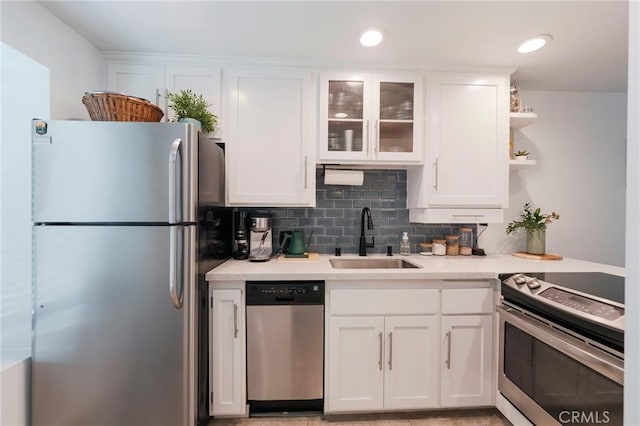 1600 Redondo Ave Unit 4, Long Beach, CA 90804 - kitchen with appliances with stainless steel finishes, white cabinetry, and light countertops
