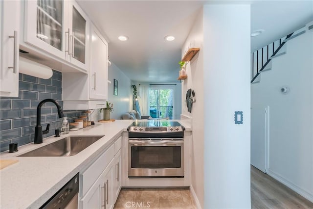 1600 Redondo Ave Unit 4, Long Beach, CA 90804 - kitchen with appliances with stainless steel finishes, white cabinets, light countertops, and recessed lighting
