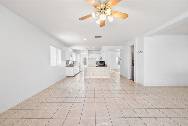 2613 Lincoln Ln, Palmdale, CA 93551 - unfurnished living room featuring baseboards, a ceiling fan, visible vents, and light tile patterned floors