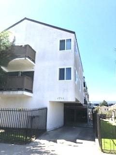 view of building exterior featuring fence