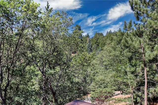 view of landscape with a view of trees