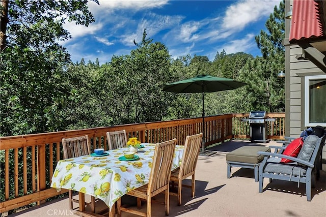 view of patio featuring outdoor dining space and a grill