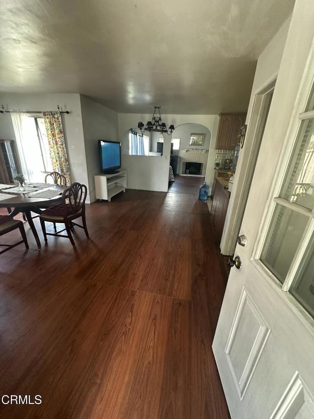 1014 Rialto St, Oxnard, CA 93035 - dining room with arched walkways, dark wood-type flooring, and plenty of natural light