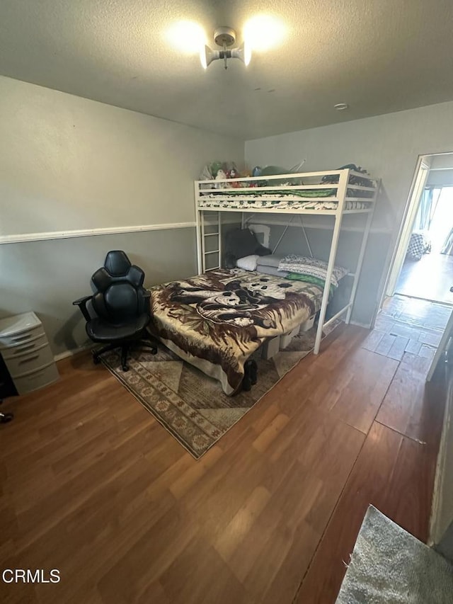 1014 Rialto St, Oxnard, CA 93035 - bedroom featuring a textured ceiling and wood finished floors