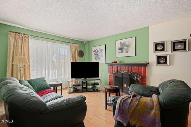 1126 Lawrence Way, Oxnard, CA 93035 - living room with a textured ceiling, wood finished floors, and a fireplace