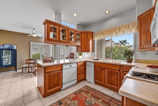 4981 Lamia Way, Oceanside, CA 92056 - kitchen with white appliances, brown cabinetry, a peninsula, and recessed lighting
