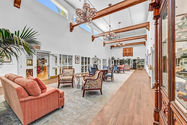 4981 Lamia Way, Oceanside, CA 92056 - living room with a towering ceiling, a chandelier, and wood finished floors