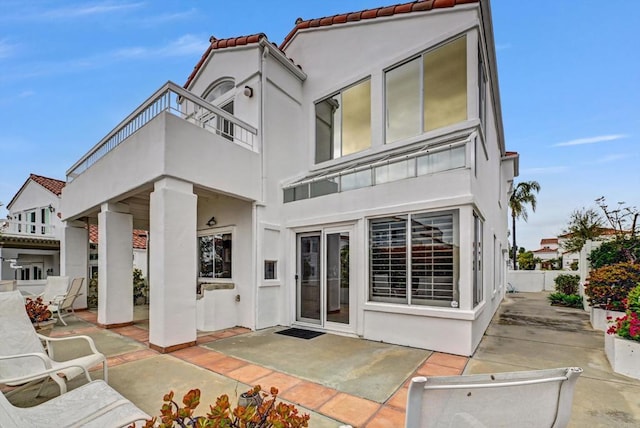 4981 Lamia Way, Oceanside, CA 92056 - back of house with a patio area, a balcony, stucco siding, and a tile roof