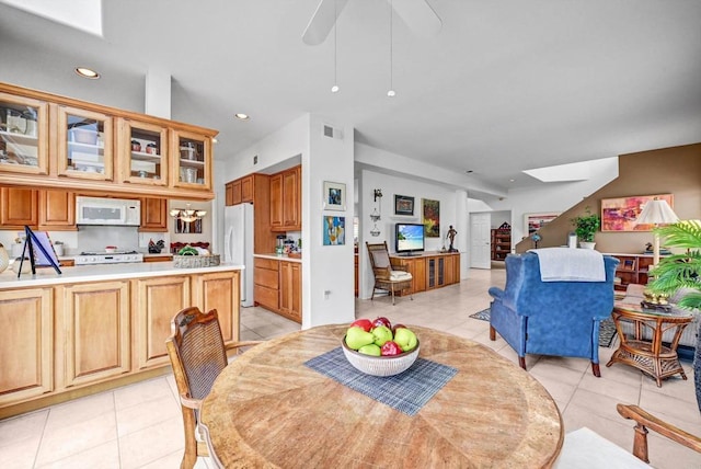 4981 Lamia Way, Oceanside, CA 92056 - dining area featuring a skylight, light tile patterned floors, recessed lighting, and a ceiling fan