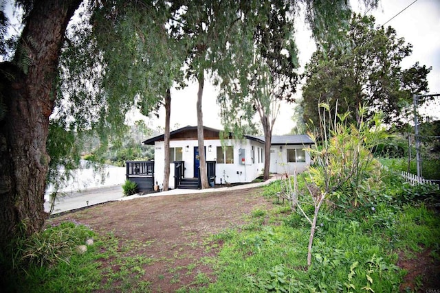 rear view of property with fence