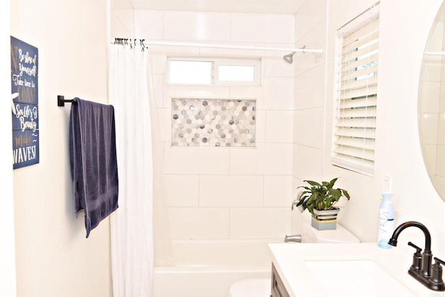 bathroom featuring shower / tub combo, toilet, and vanity