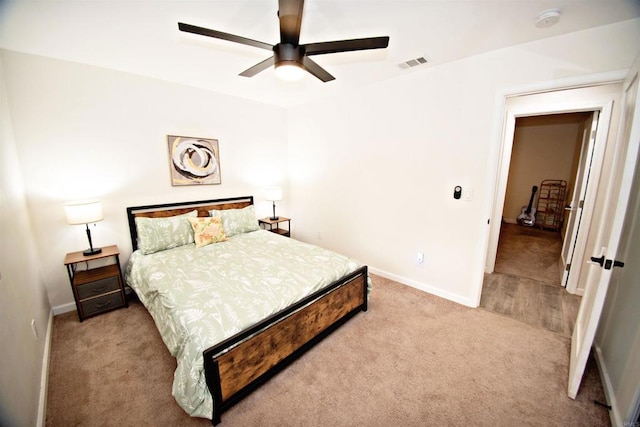 bedroom featuring baseboards, visible vents, carpet, and ceiling fan