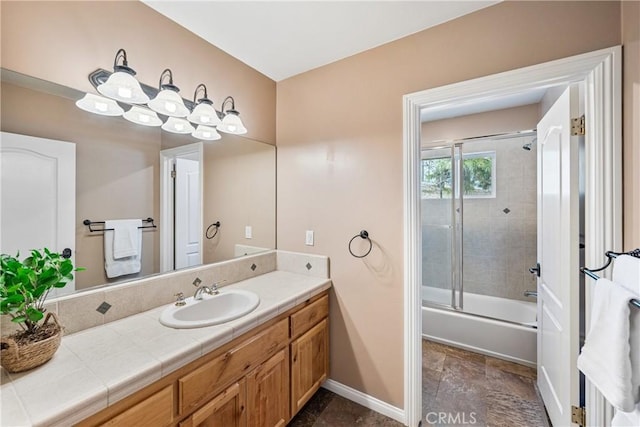 28136 N Bay Rd, Lake Arrowhead, CA 92352 - full bathroom with baseboards, vanity, bath / shower combo with glass door, and stone finish floors