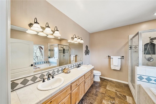 28136 N Bay Rd, Lake Arrowhead, CA 92352 - bathroom with double vanity, a bath, a stall shower, and baseboards