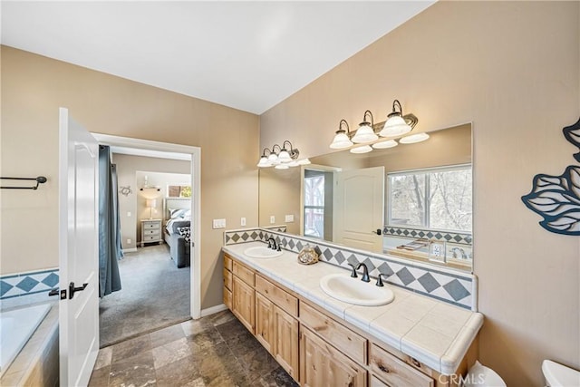 28136 N Bay Rd, Lake Arrowhead, CA 92352 - ensuite bathroom featuring double vanity, plenty of natural light, toilet, and tiled tub