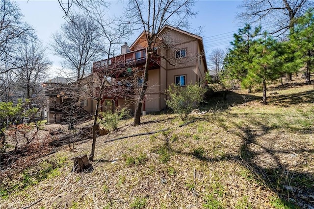 28136 N Bay Rd, Lake Arrowhead, CA 92352 - back of house with a chimney and a balcony