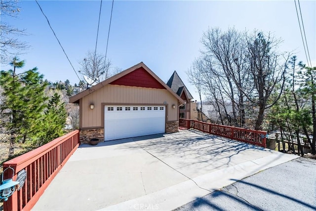 28136 N Bay Rd, Lake Arrowhead, CA 92352 - view of property exterior with stone siding and driveway
