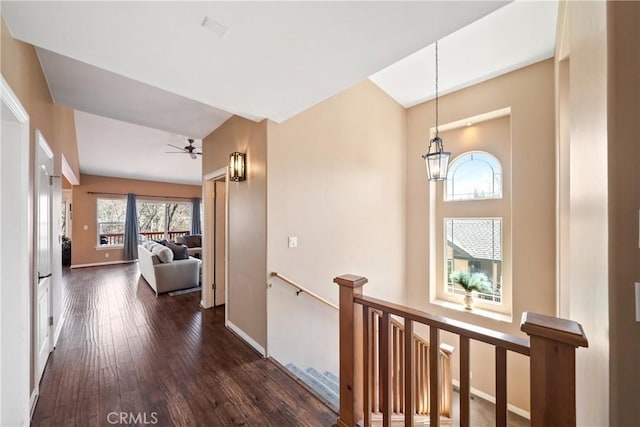 28136 N Bay Rd, Lake Arrowhead, CA 92352 - hallway featuring an upstairs landing, dark wood-style flooring, baseboards, and a chandelier