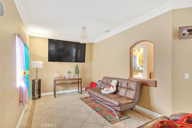 living room with arched walkways, baseboards, visible vents, tile patterned flooring, and ornamental molding
