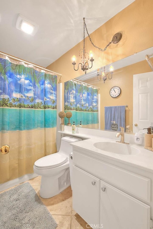 full bath featuring tile patterned floors, a shower with curtain, toilet, a chandelier, and vanity