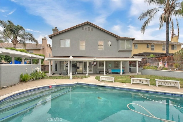 view of pool with a patio area, a fenced in pool, and a fenced backyard