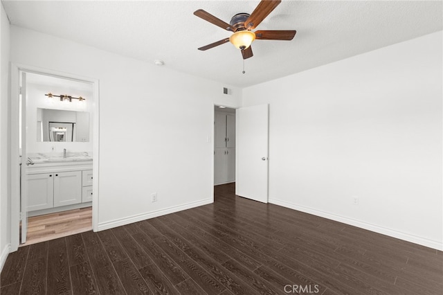 1729 S Alma St, San Pedro, CA 90731 - unfurnished bedroom with dark wood finished floors, connected bathroom, and a ceiling fan