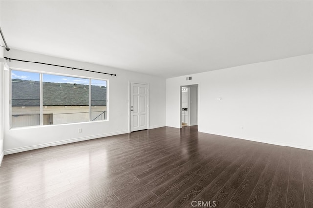 1729 S Alma St, San Pedro, CA 90731 - empty room with dark wood-type flooring and baseboards