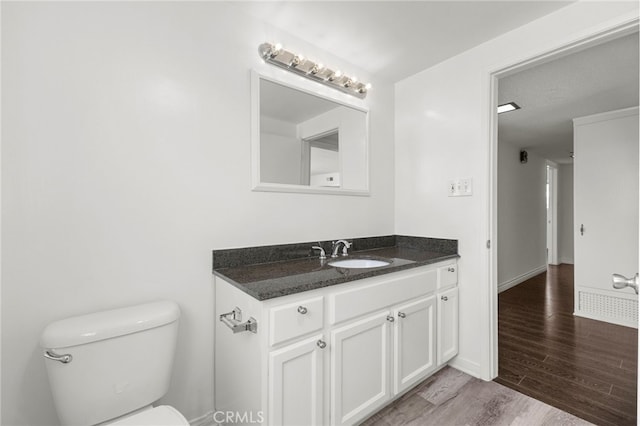 1729 S Alma St, San Pedro, CA 90731 - half bath featuring vanity and wood finished floors