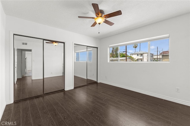 1729 S Alma St, San Pedro, CA 90731 - unfurnished bedroom featuring multiple closets, wood finished floors, a textured ceiling, and ceiling fan