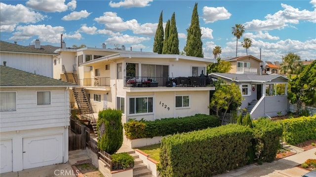 1729 S Alma St, San Pedro, CA 90731 - view of front of house with stairs, a residential view, and stucco siding